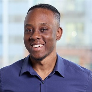 Shakir Copeland in a blue shirt, in front of a window