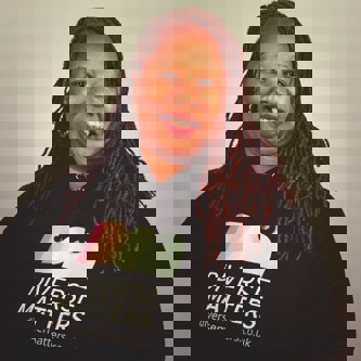 Natasha Broomfield-Reid in a hoodie with logo printed on it saying 'diverse matters'.