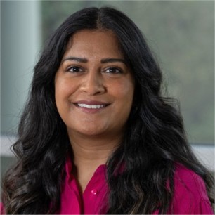 Namita Matkar in a pink blouse, in front of a window